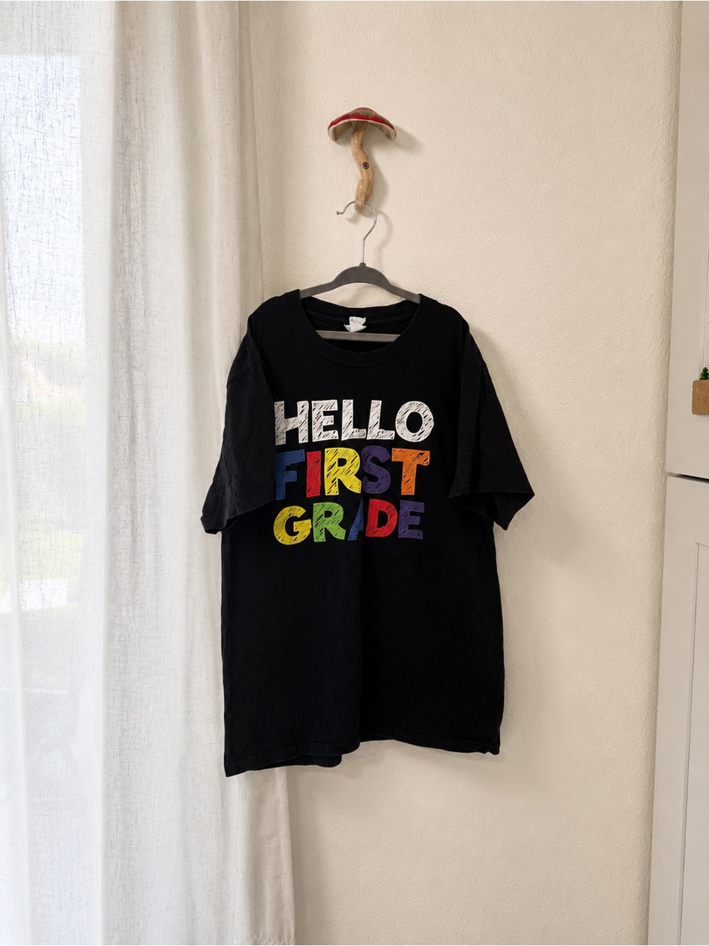 Port and Company Black "Hello First Grade" Kids Tee with Multicolor Lettering